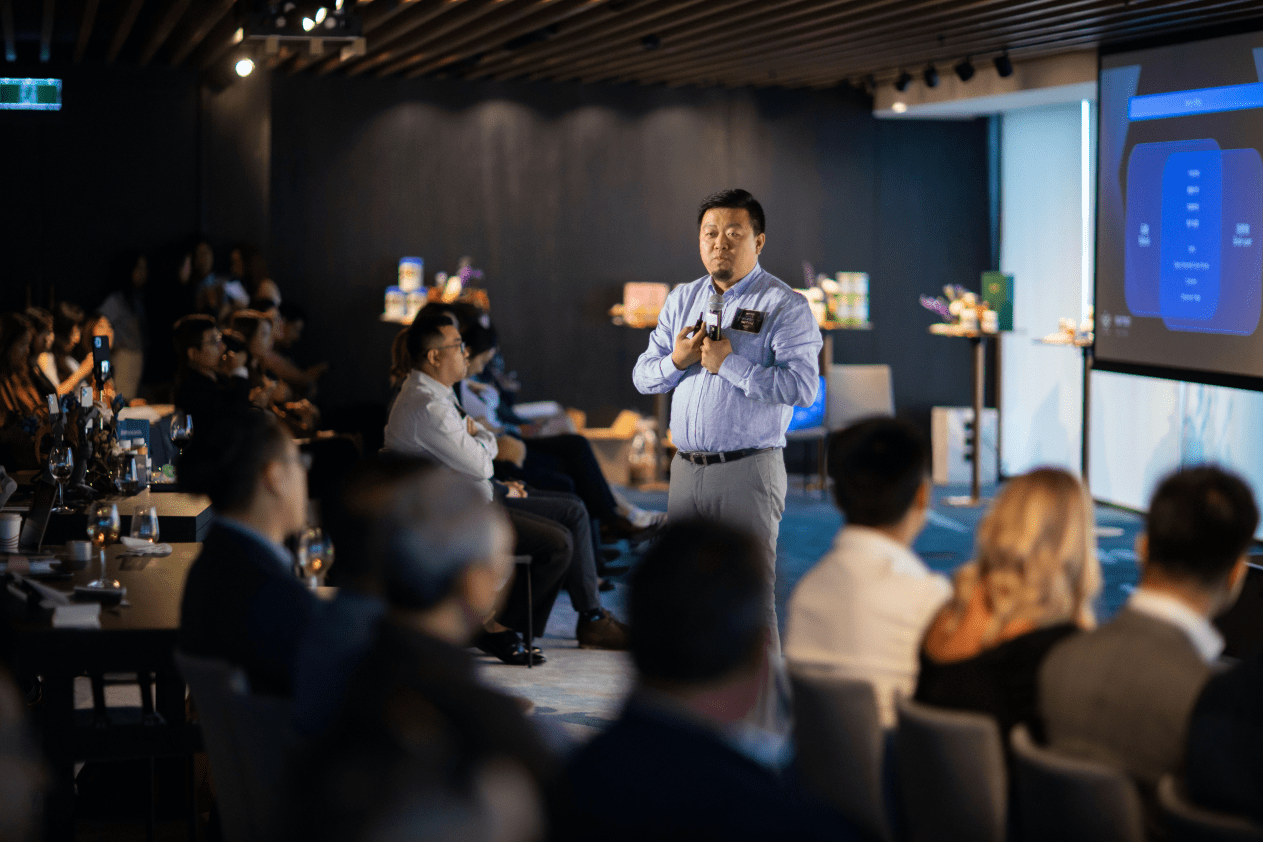 Ray Deng speaking to a business audience